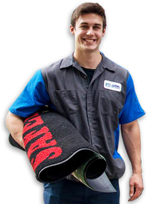Smiling employee holding mat